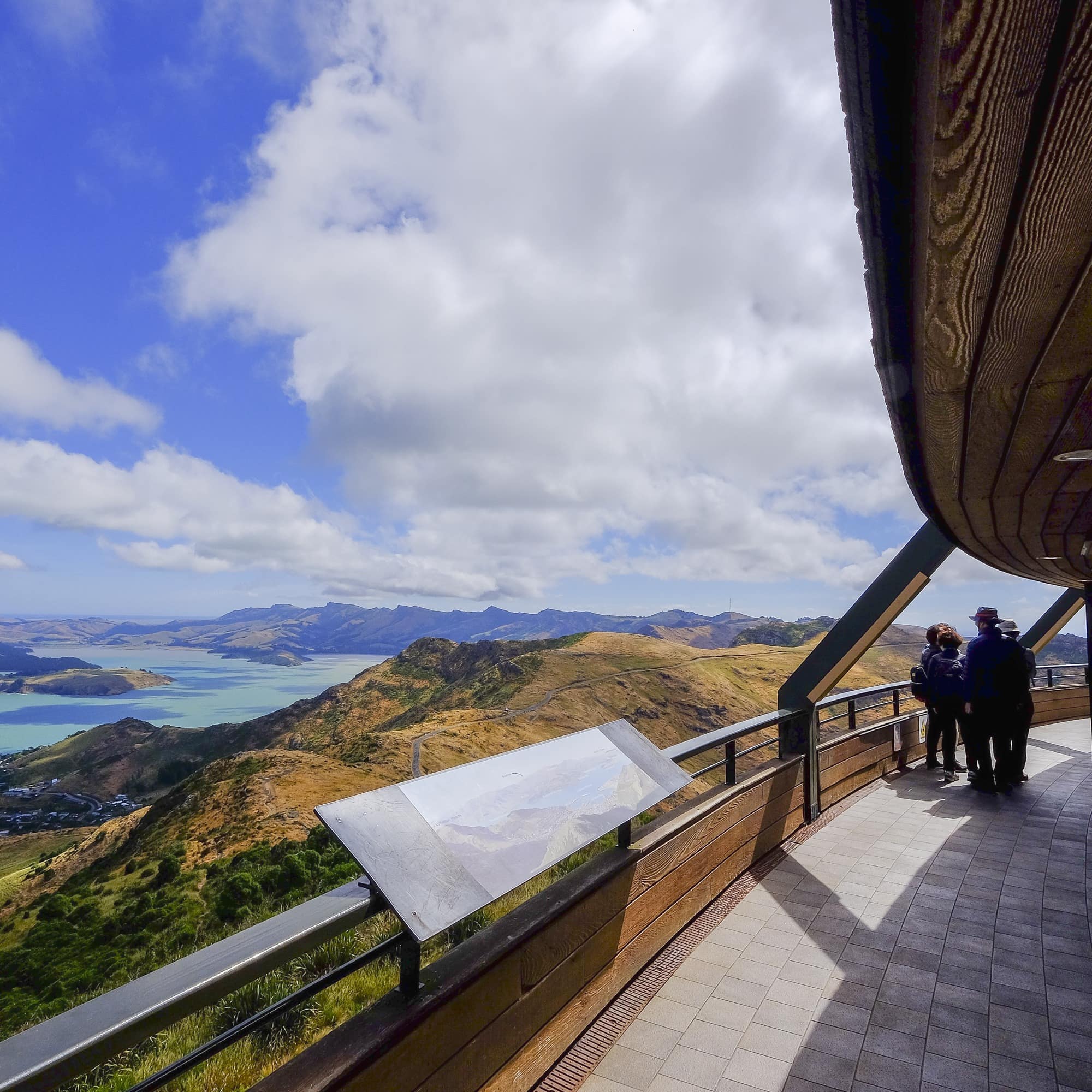 Family silhouette under overhang looking at the beautiful scenery from Christchurch Gondola Station
