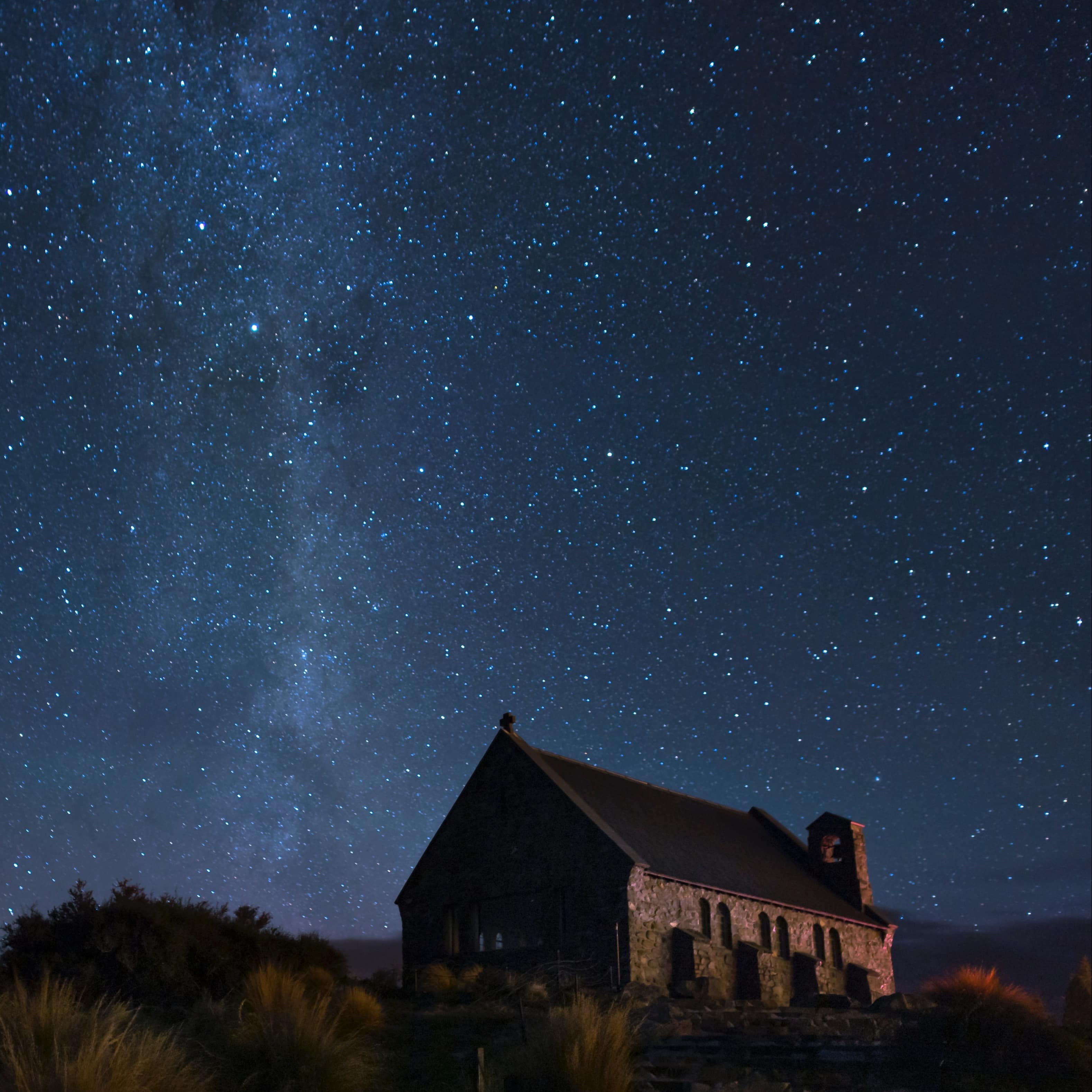 Church of the Good Shepard at Lake Tekapo at night under a clear starry sky