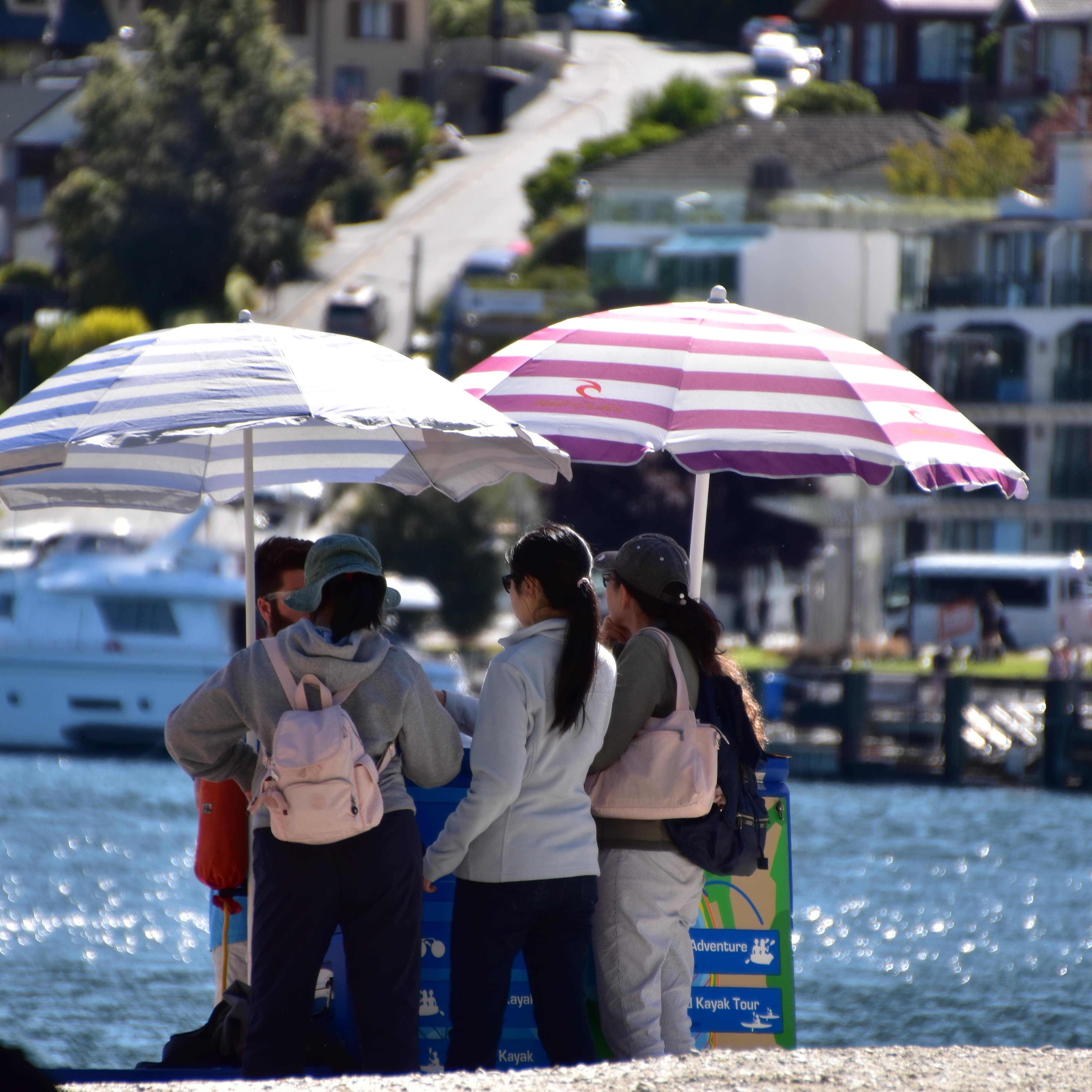 Family on the beach of Lake Wakatipu