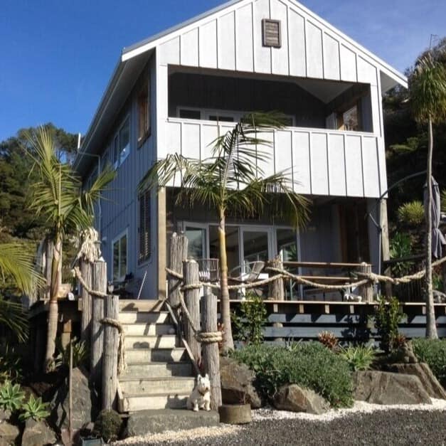 Front view of house in Cooks Beach surrounded by greenery