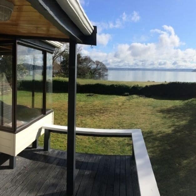 View of Lake Rotorua from the deck of a small bach