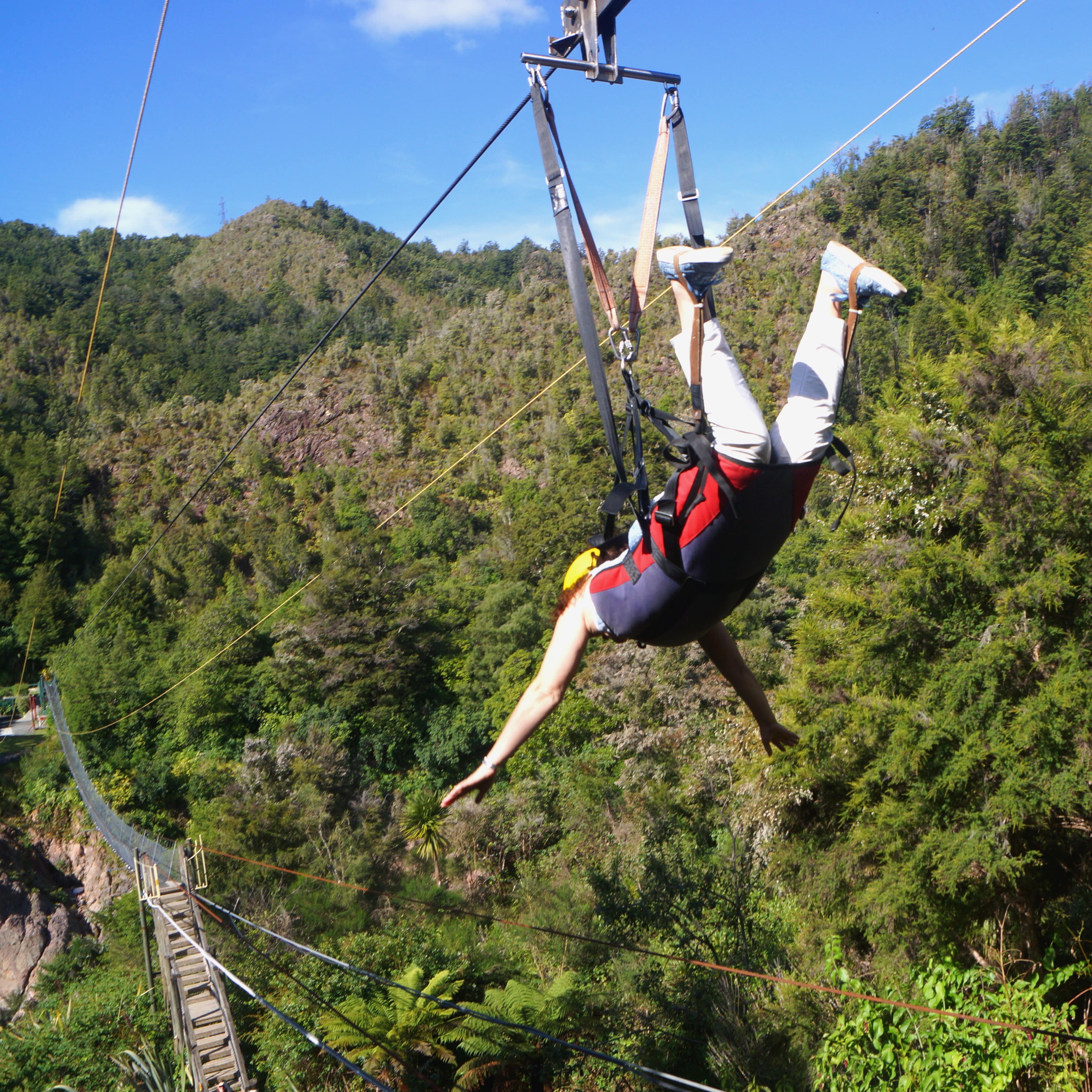 Person lying flat while zip lining in New Zealand