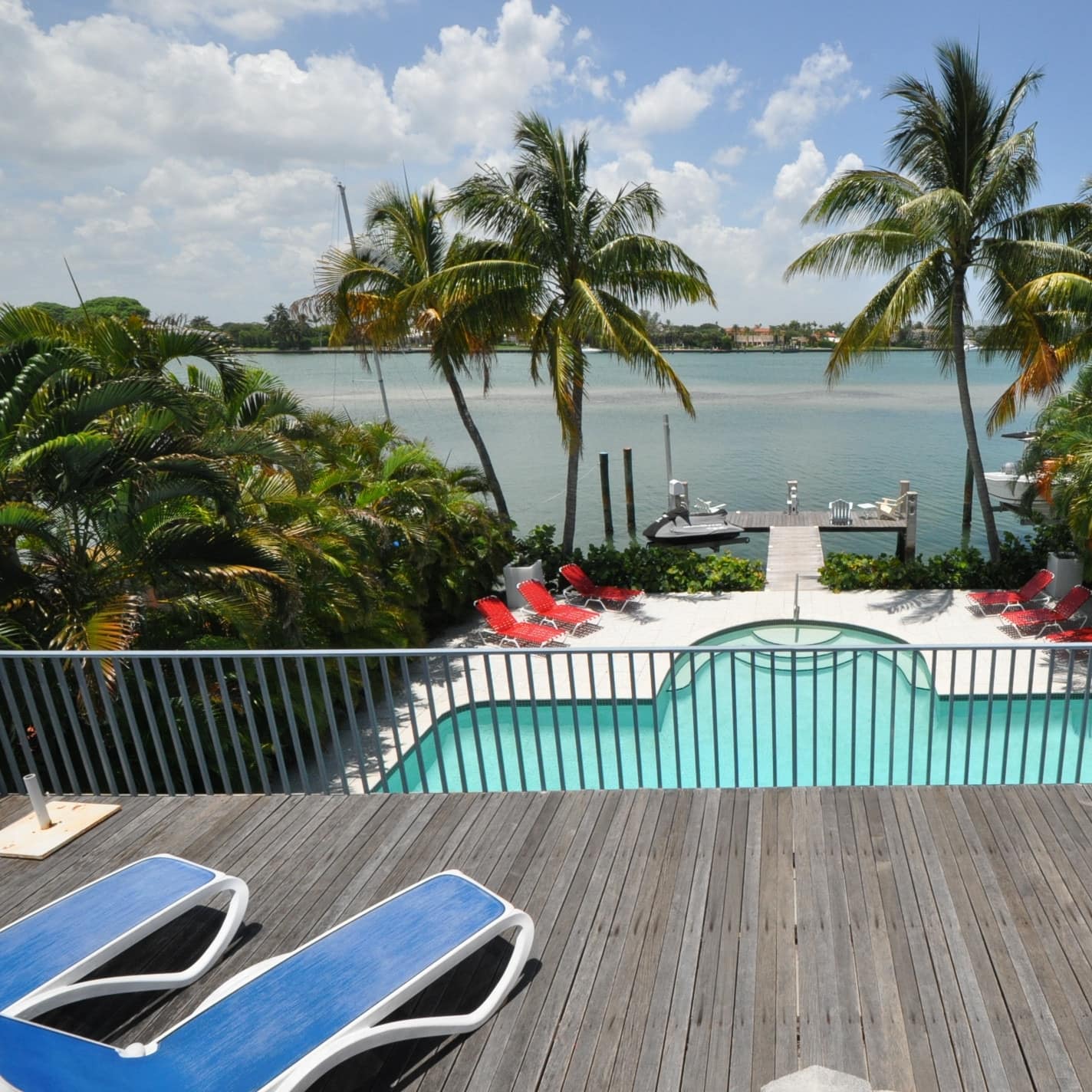 The deck, pool, and dock of a four-bedroom vacation rental in North Beach