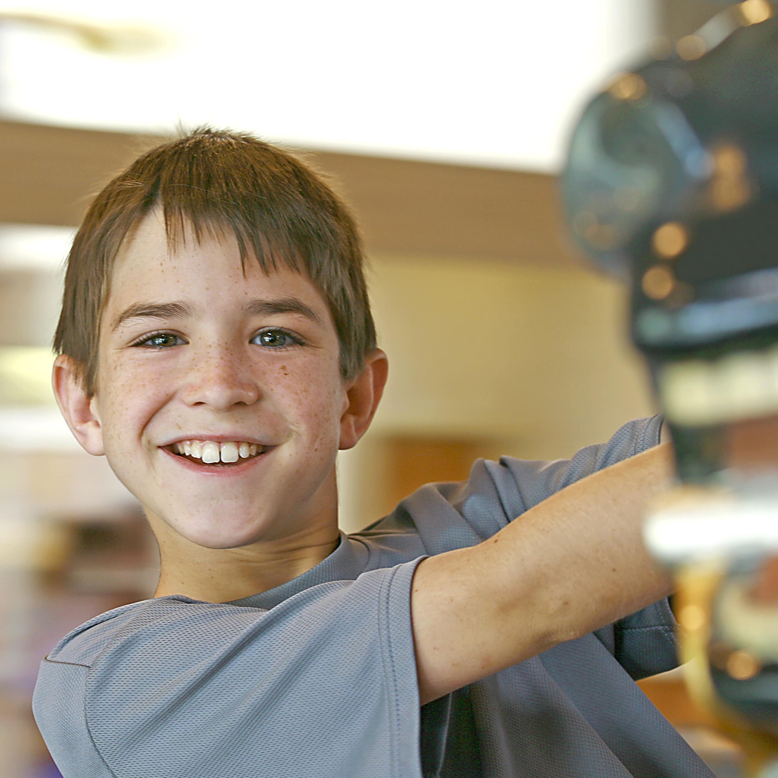 Boy with blurred background on a merry-go-round