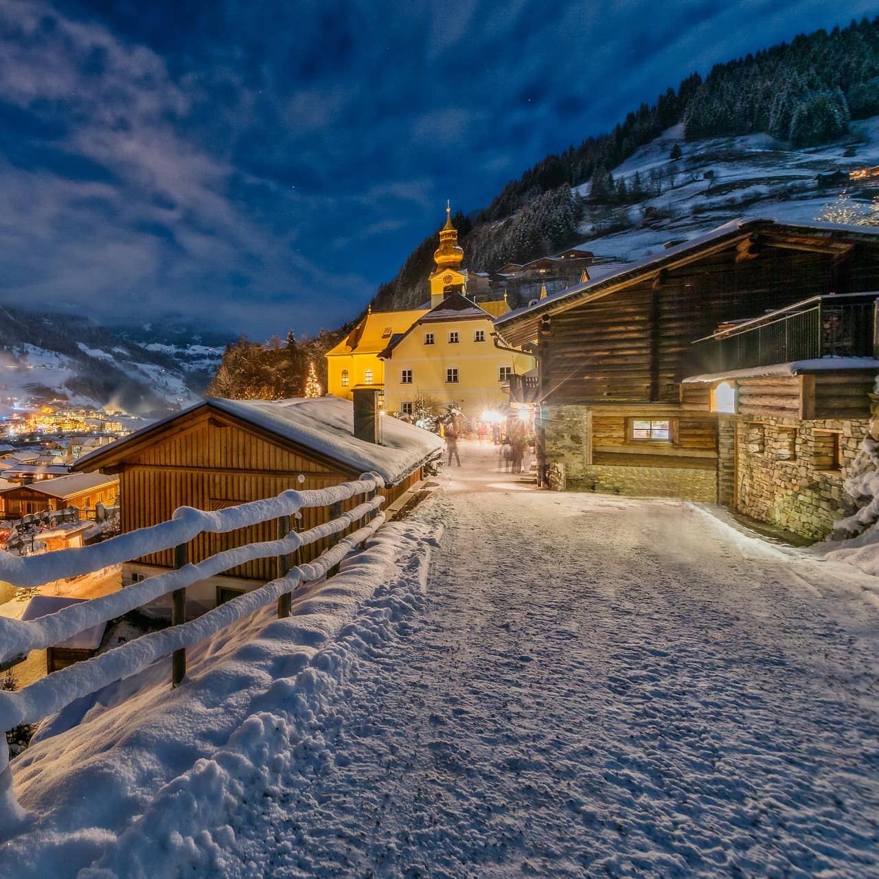 A snow-covered Austrian town at night