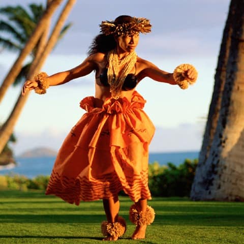 Polynesian dancer performing as the sun goes down