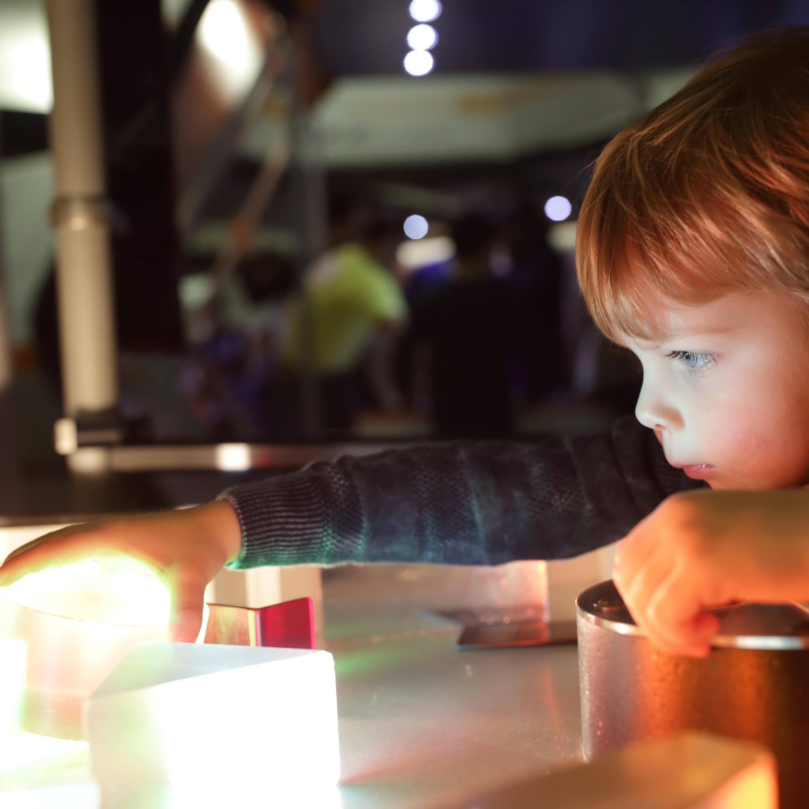 Little boy studying the refraction of light FILE
