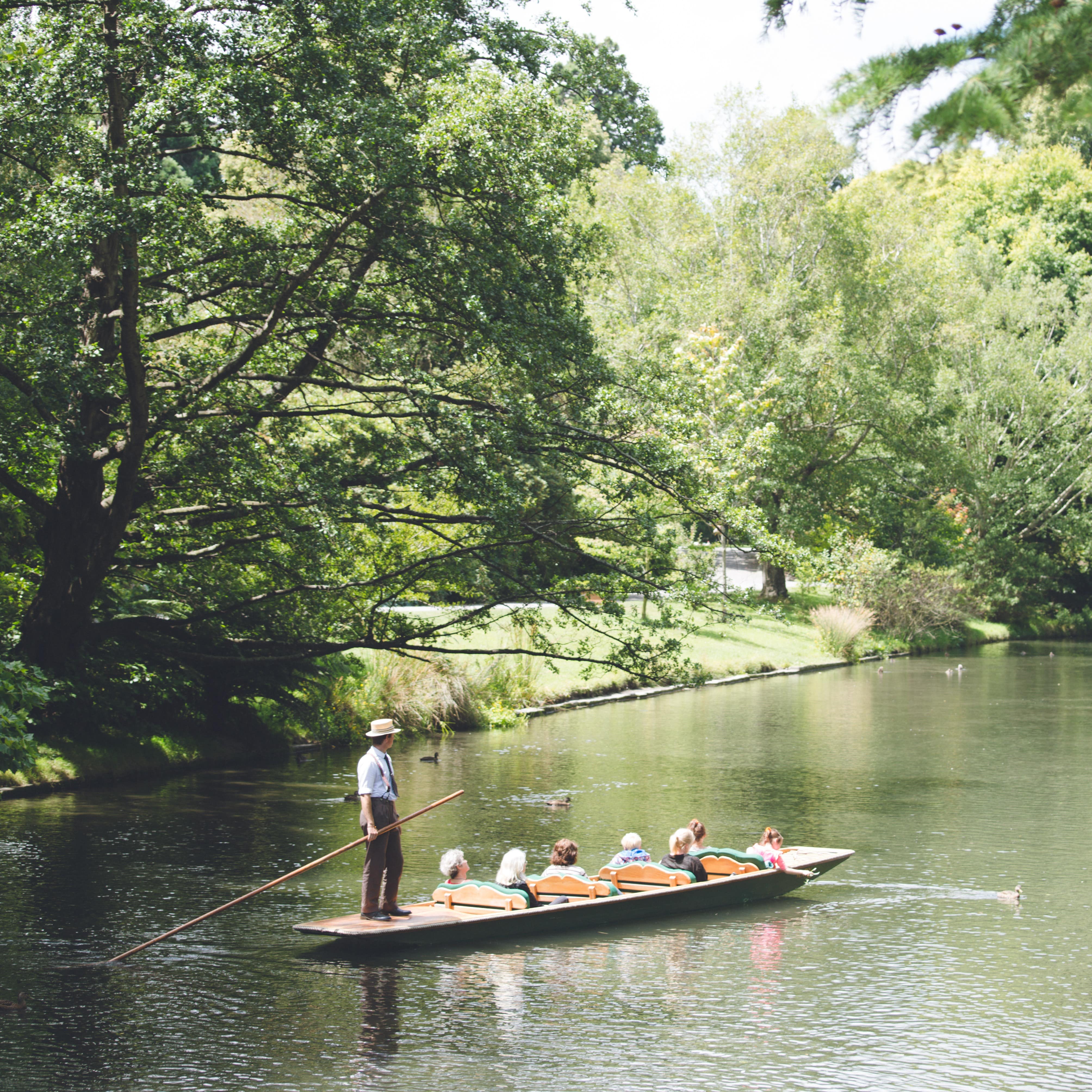Tourist punting on Avon River, Christchurch, New Zealand