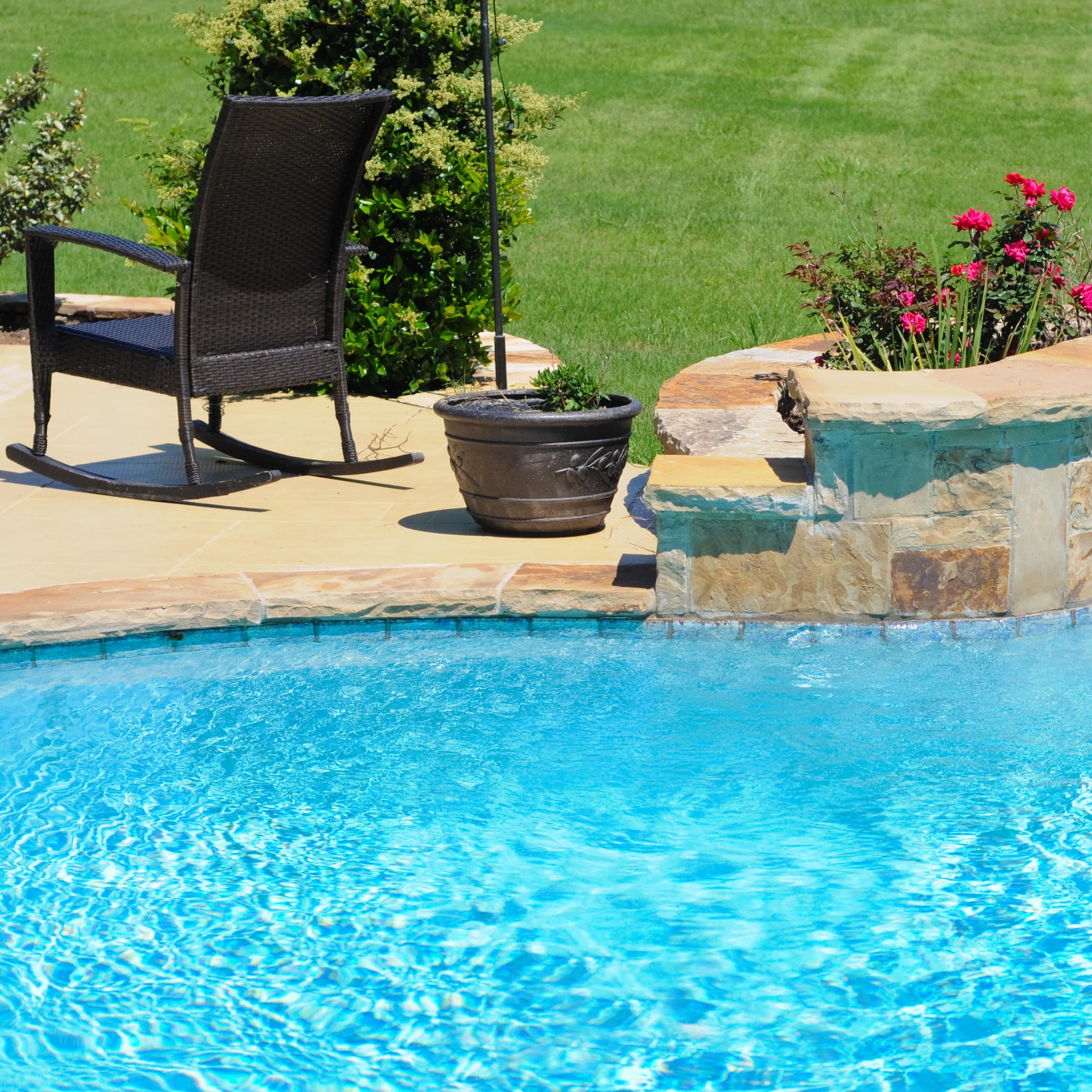 A backyard garden and pool at a home