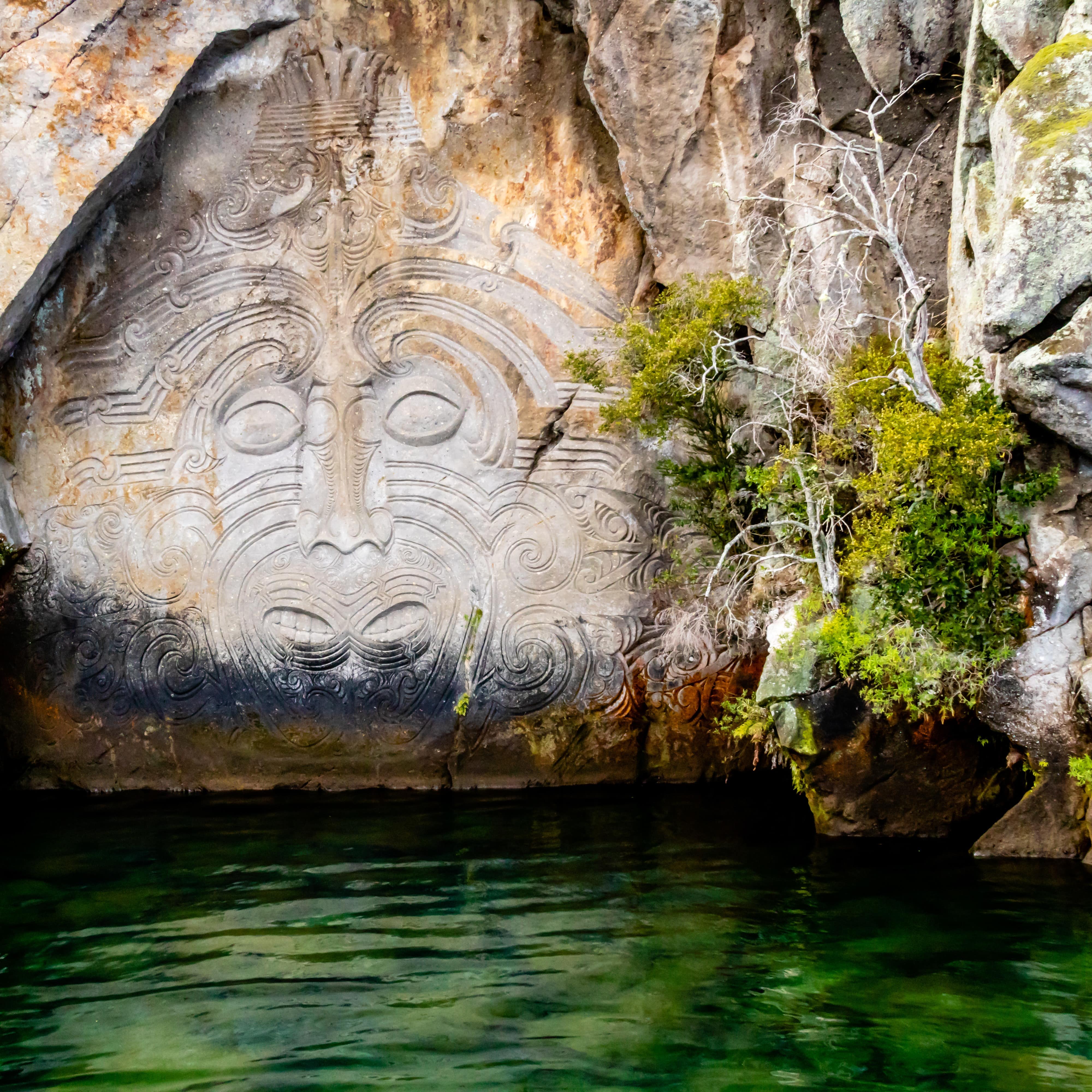 Maori rock carvings at Mine Bay on Lake Taupo, New Zealand
