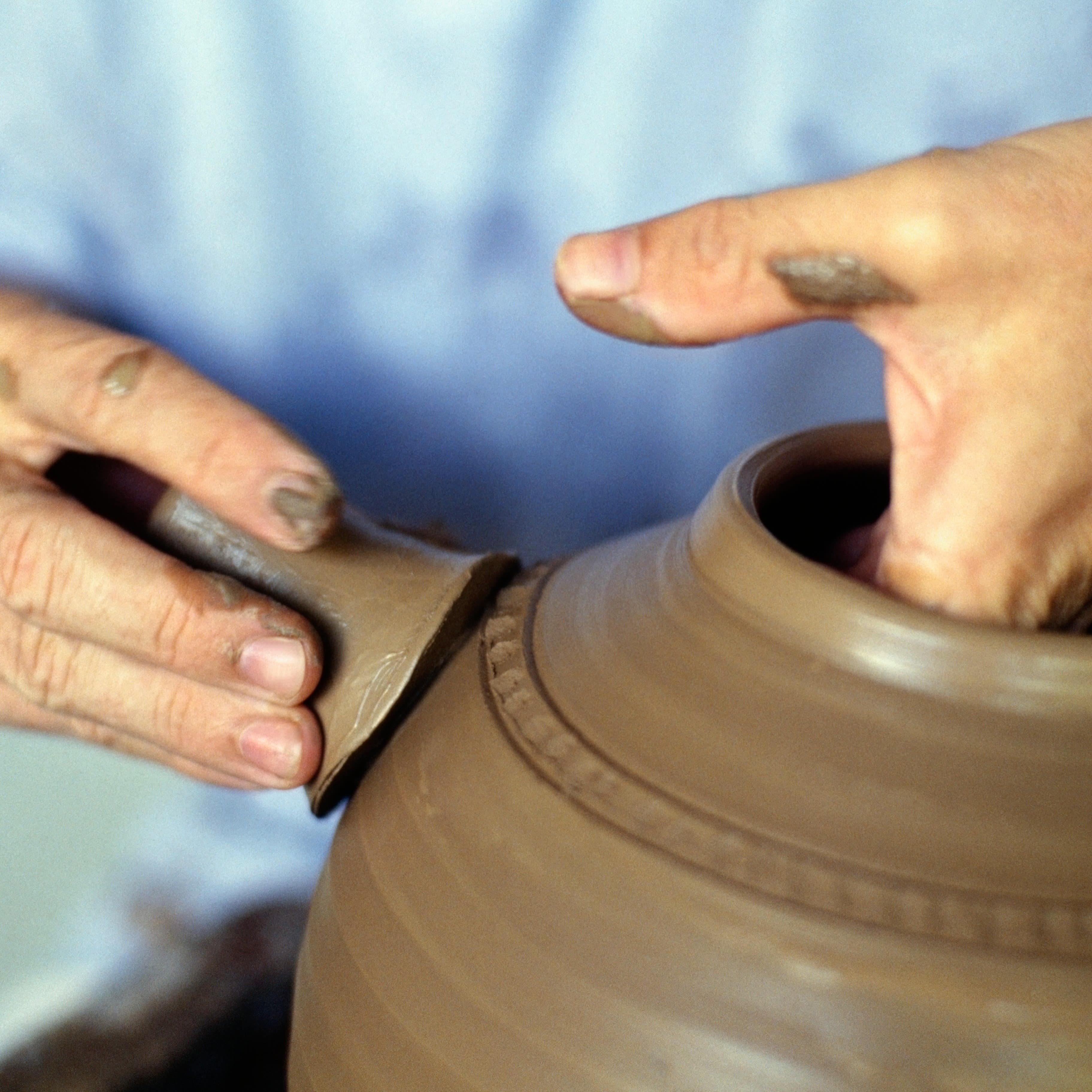 Close-up of a potter's turning a vase