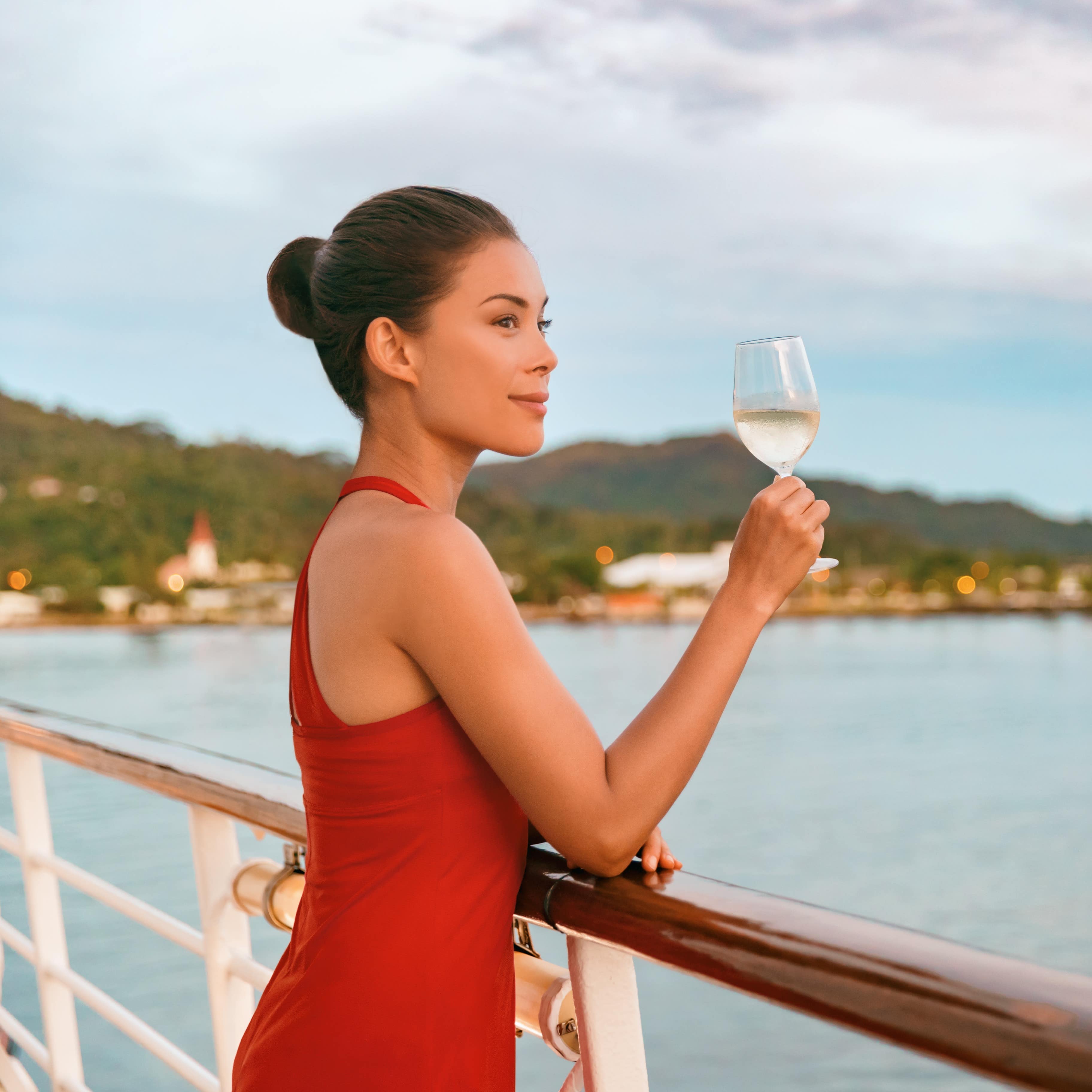 Woman drinking a glass of wine on cruise ship