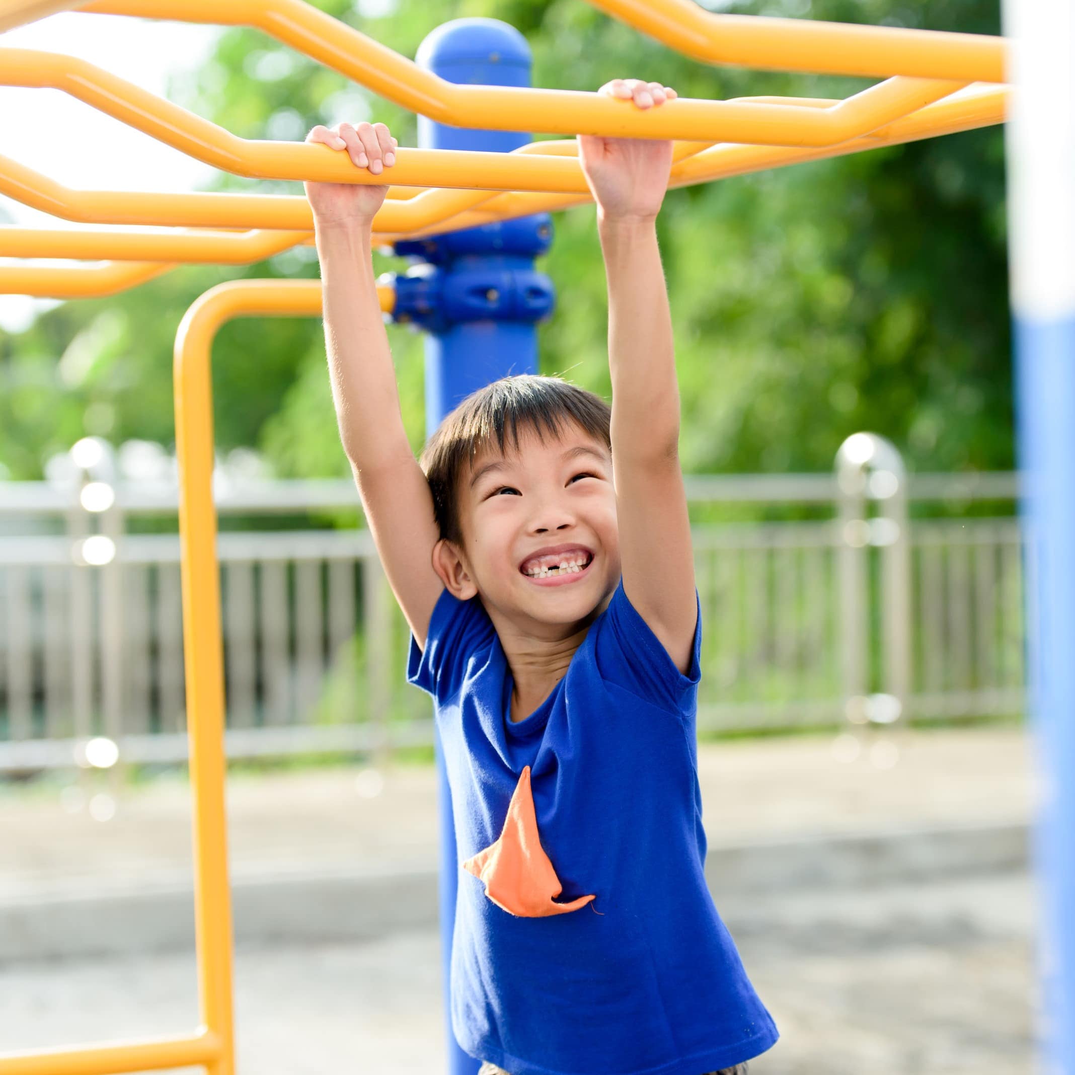 Little boy playing on outdoor playground