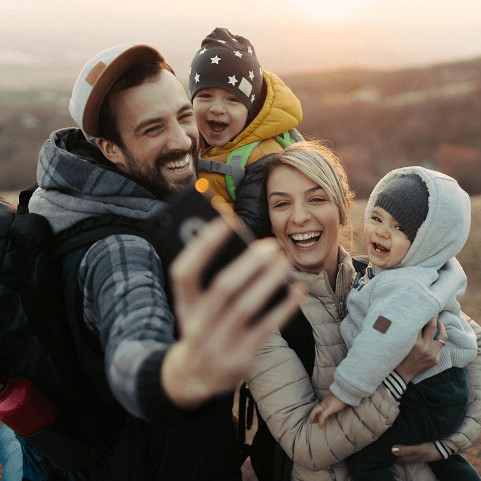family outdoors selfie, smartphone selfie