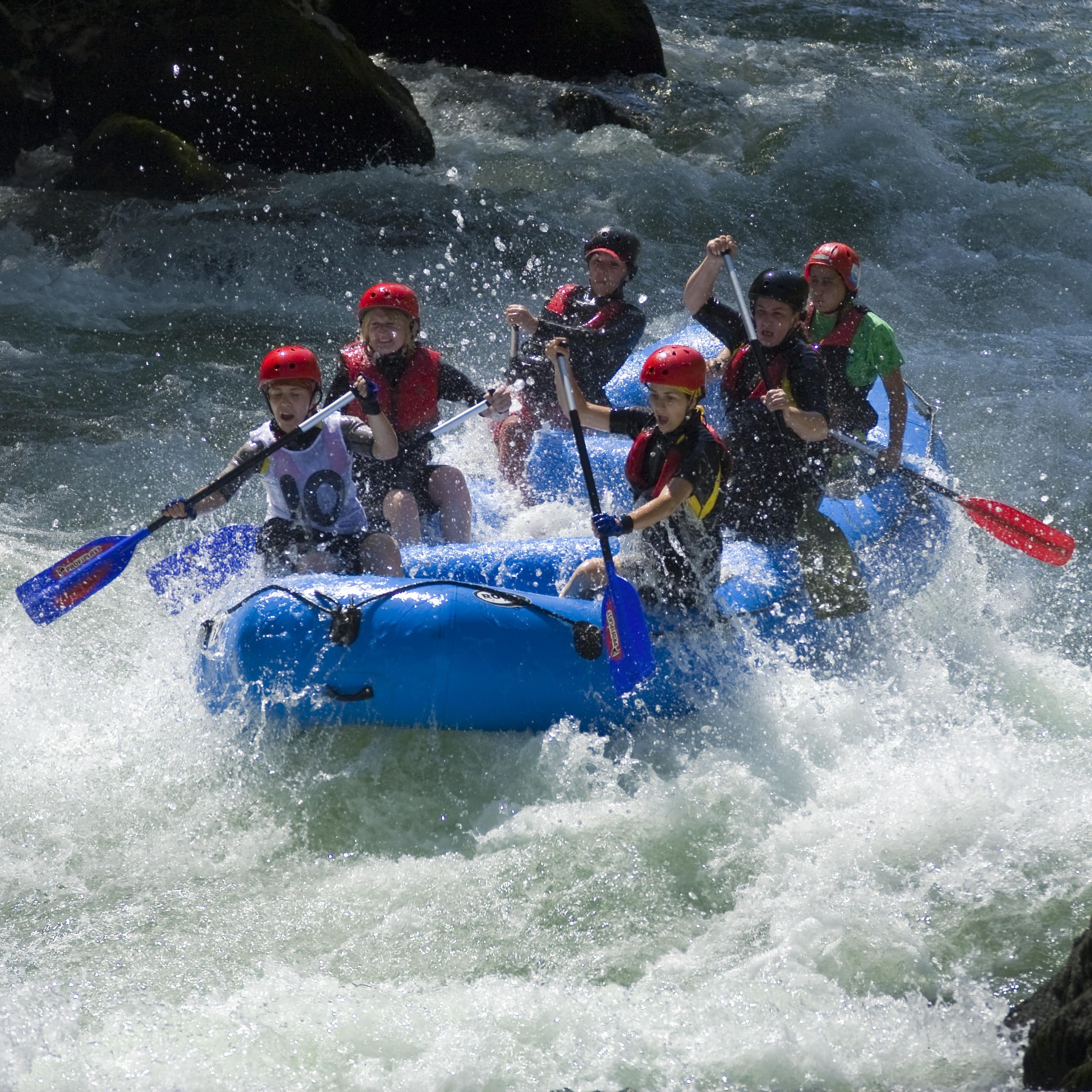 Group rafting down the rapids