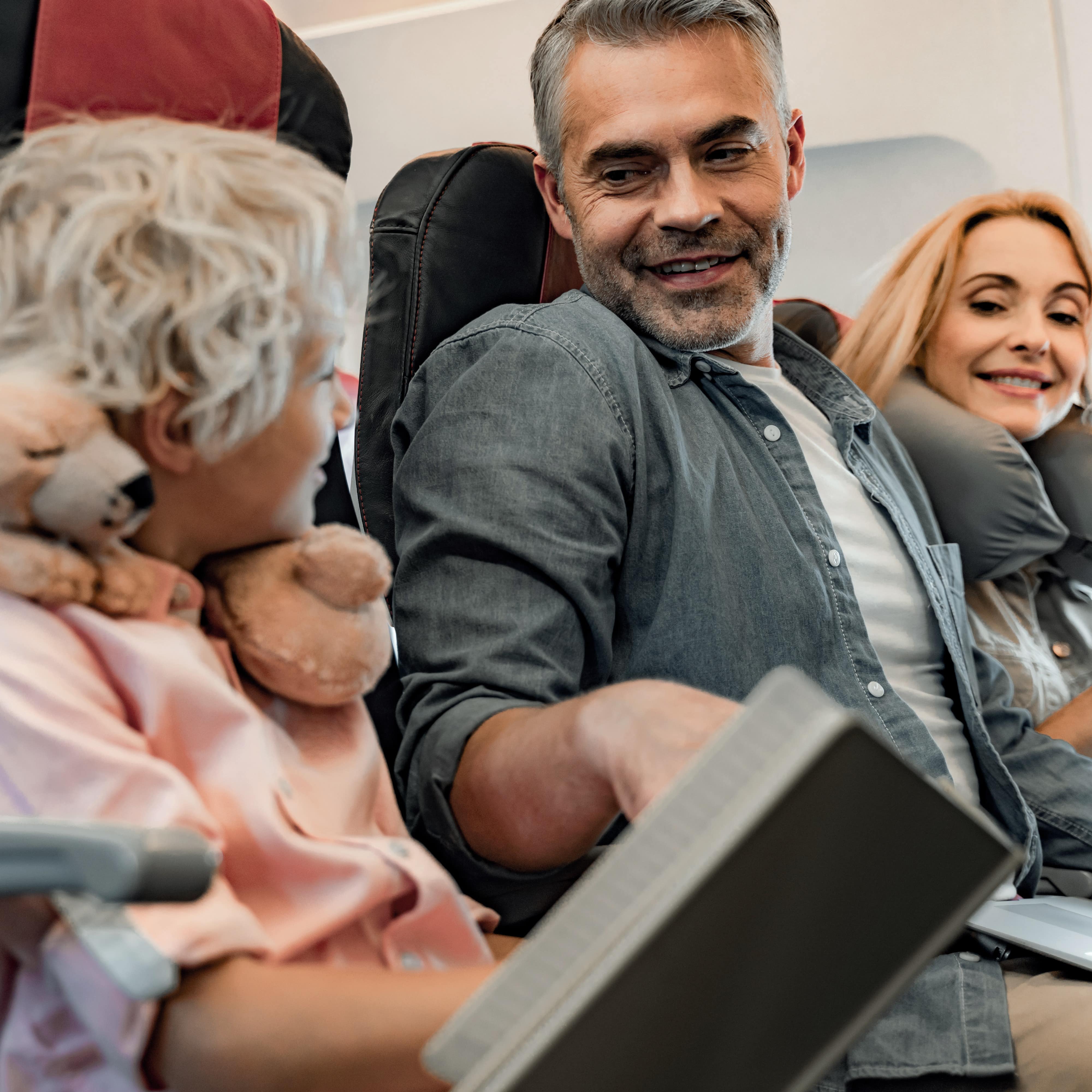 Family flying on airplane