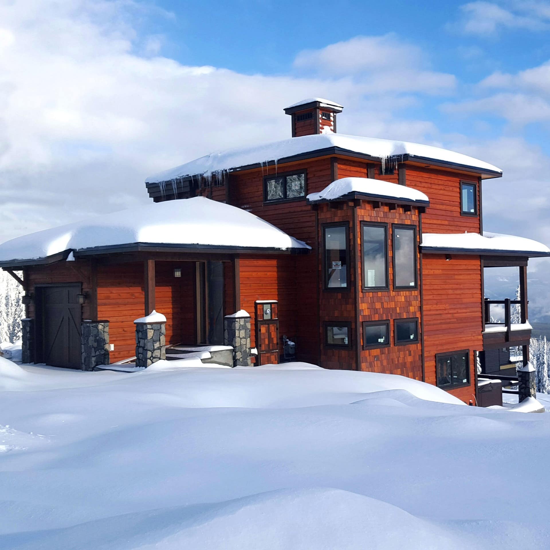 Exterior of snow covered luxury chalet in British Columbia