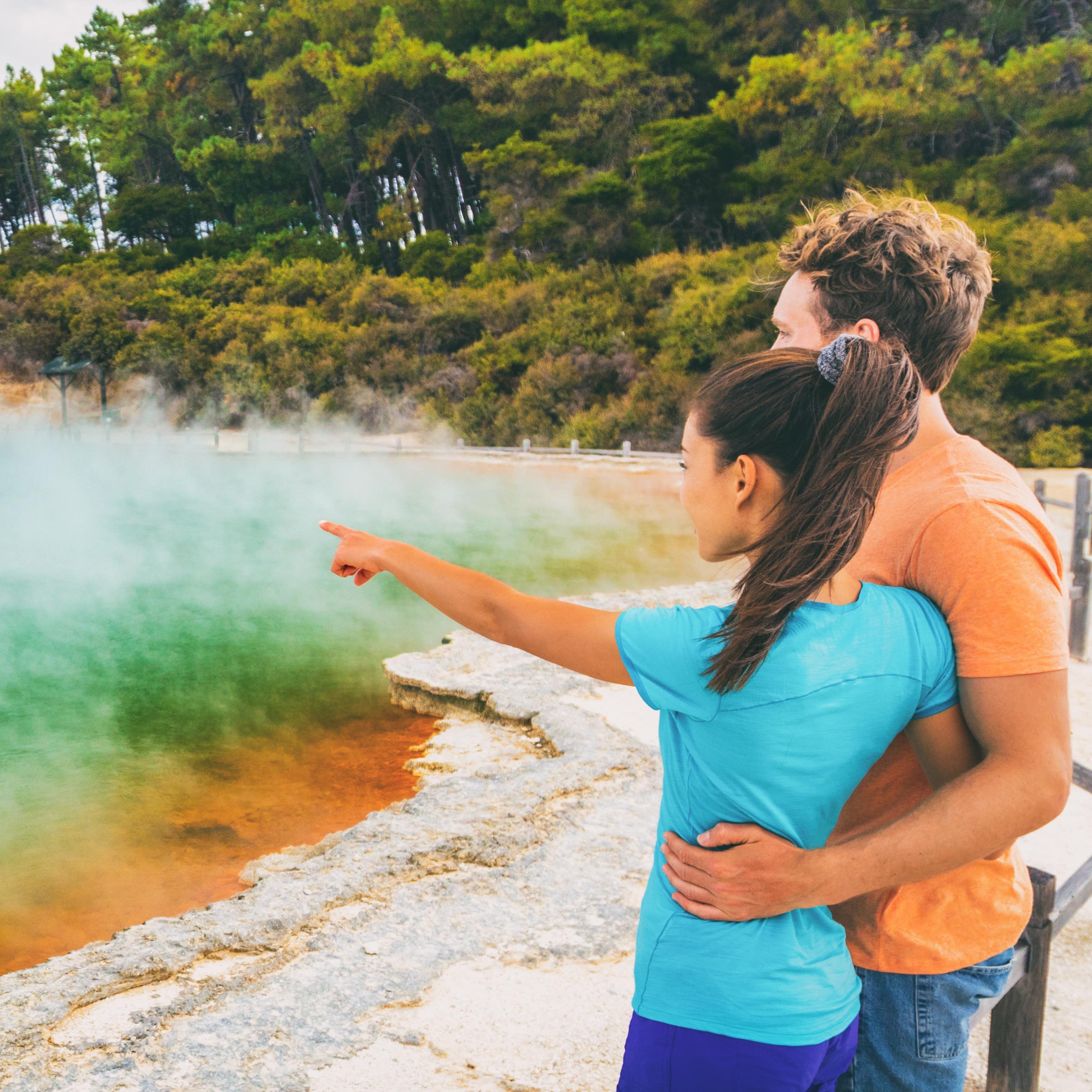 Couple at Champagne pool at Wai-O-Tapu pools Sacred Waters