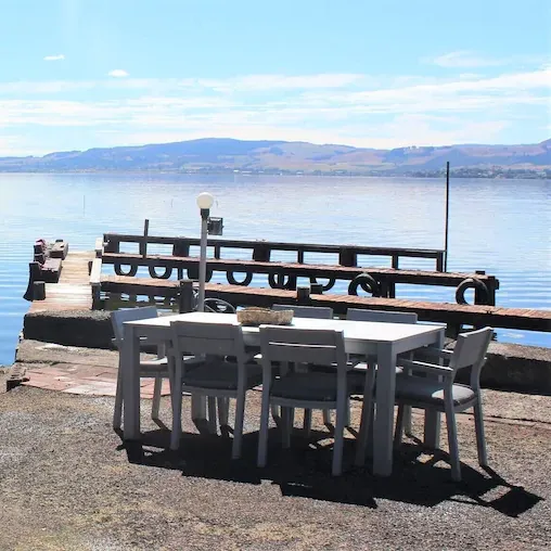 Outdoor table and lake access from apartment