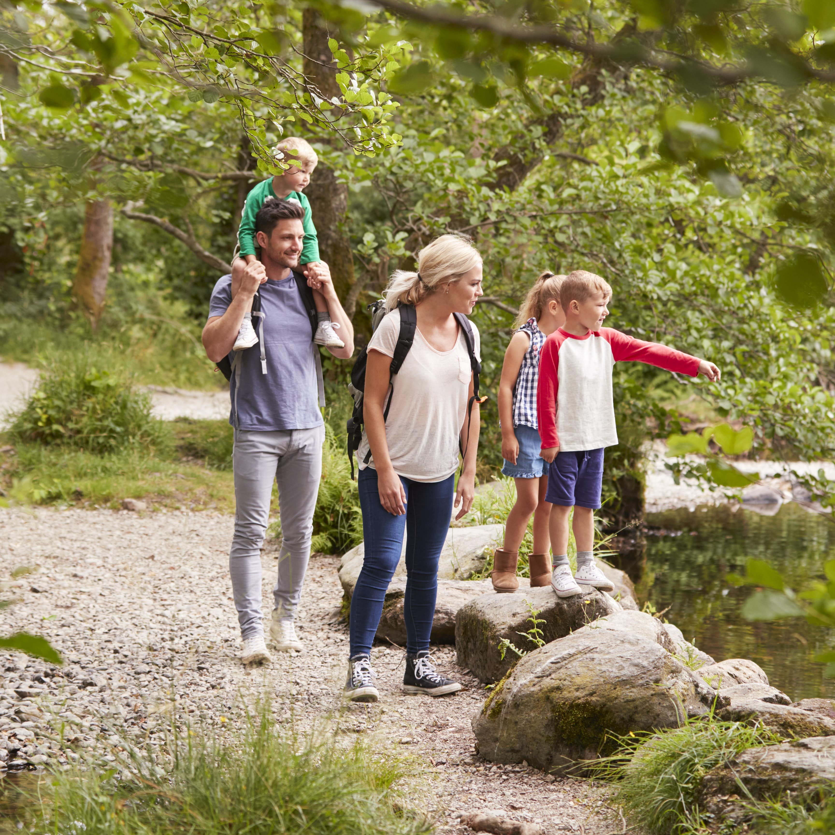 Family taking a walk along a nature trail
