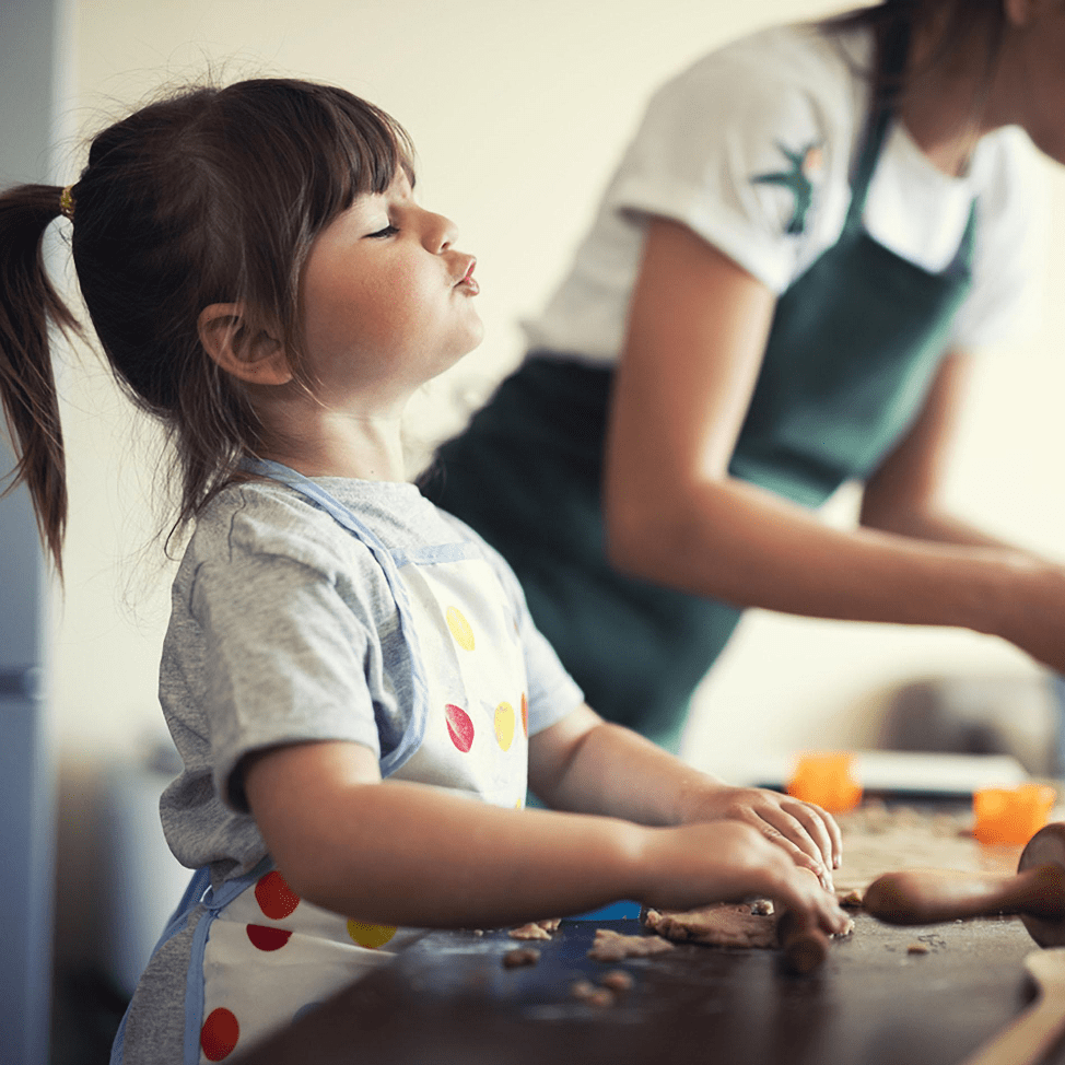mother and daughter cooking, baking