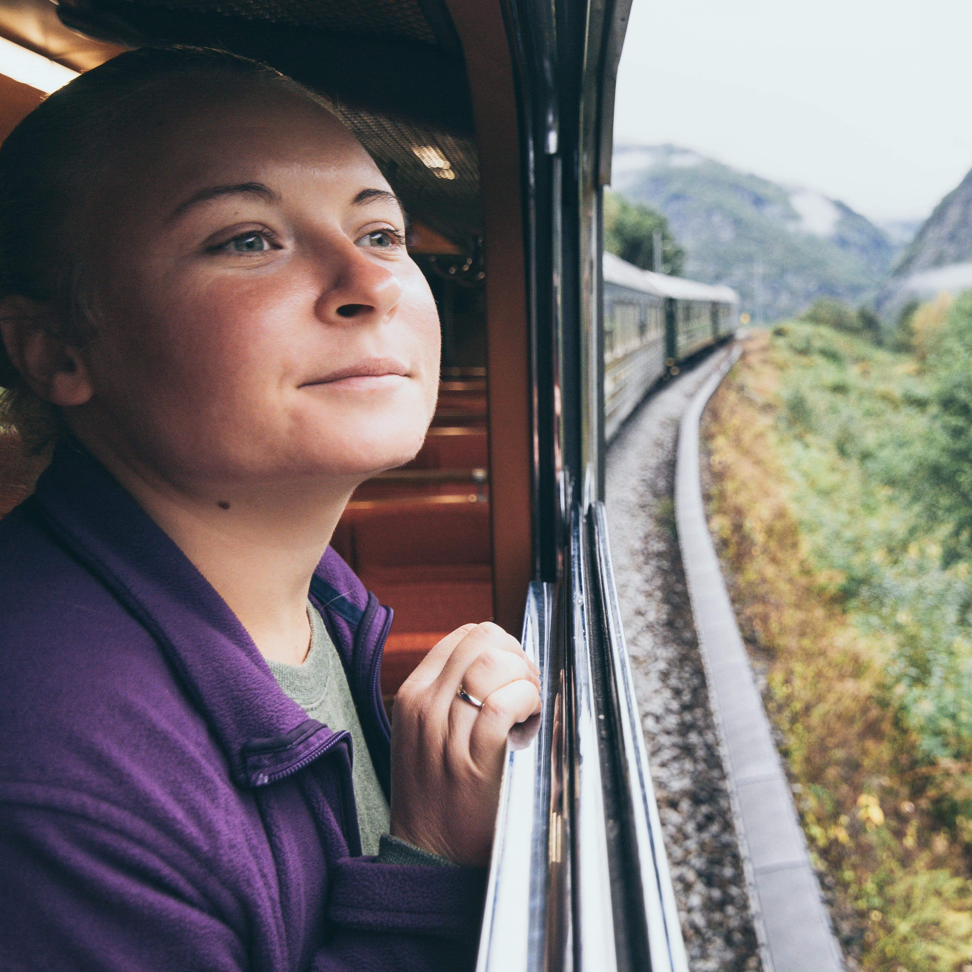 Young woman enjoying a train ride
