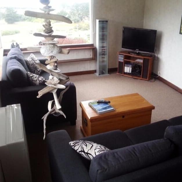 Living area of a cozy family bach in Brighton