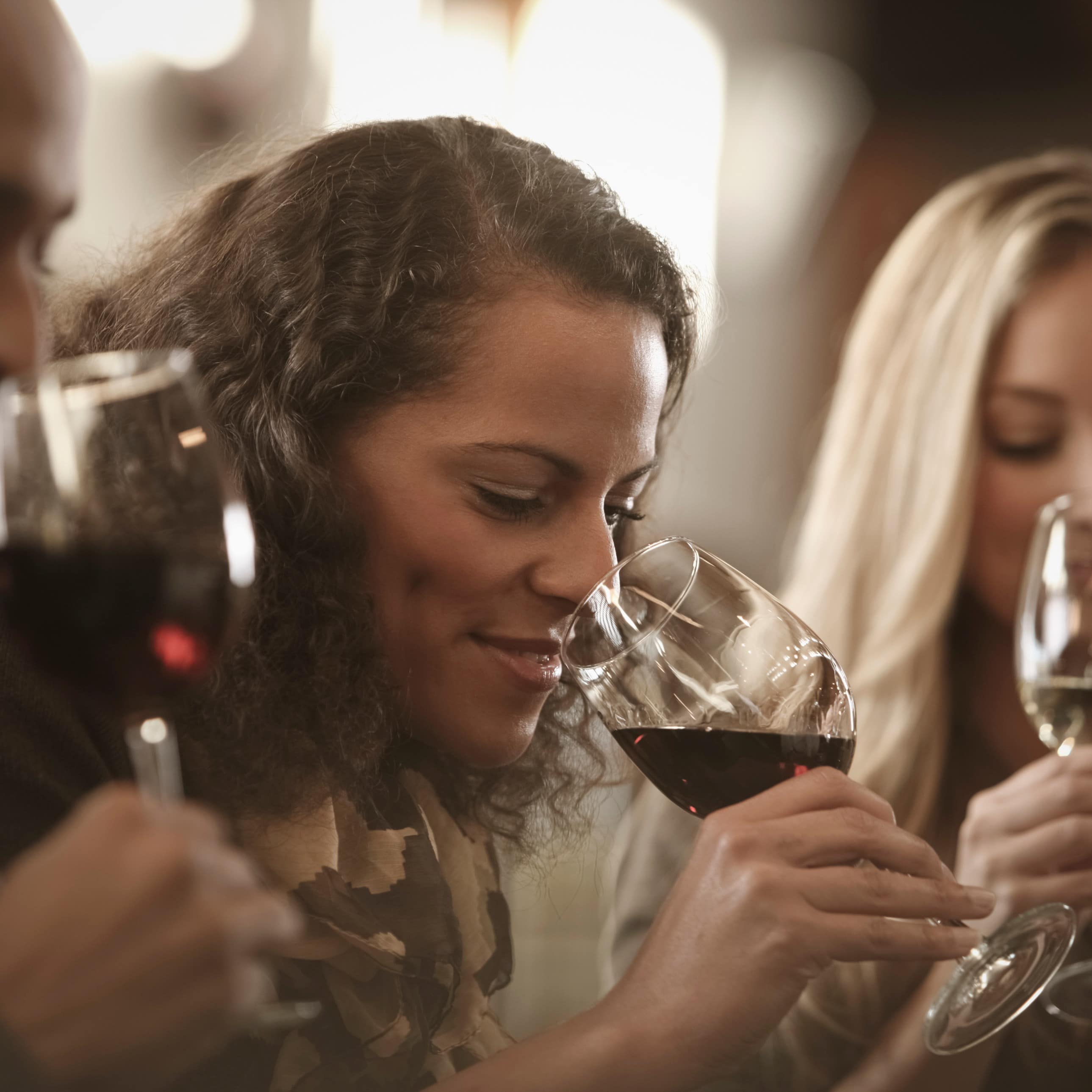 A group of people enjoying a wine tasting.