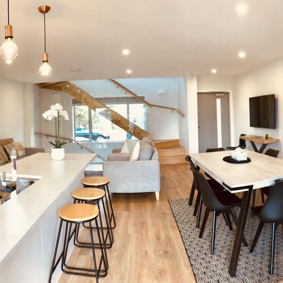 The open kitchen and dining area of a family apartment in Hamilton