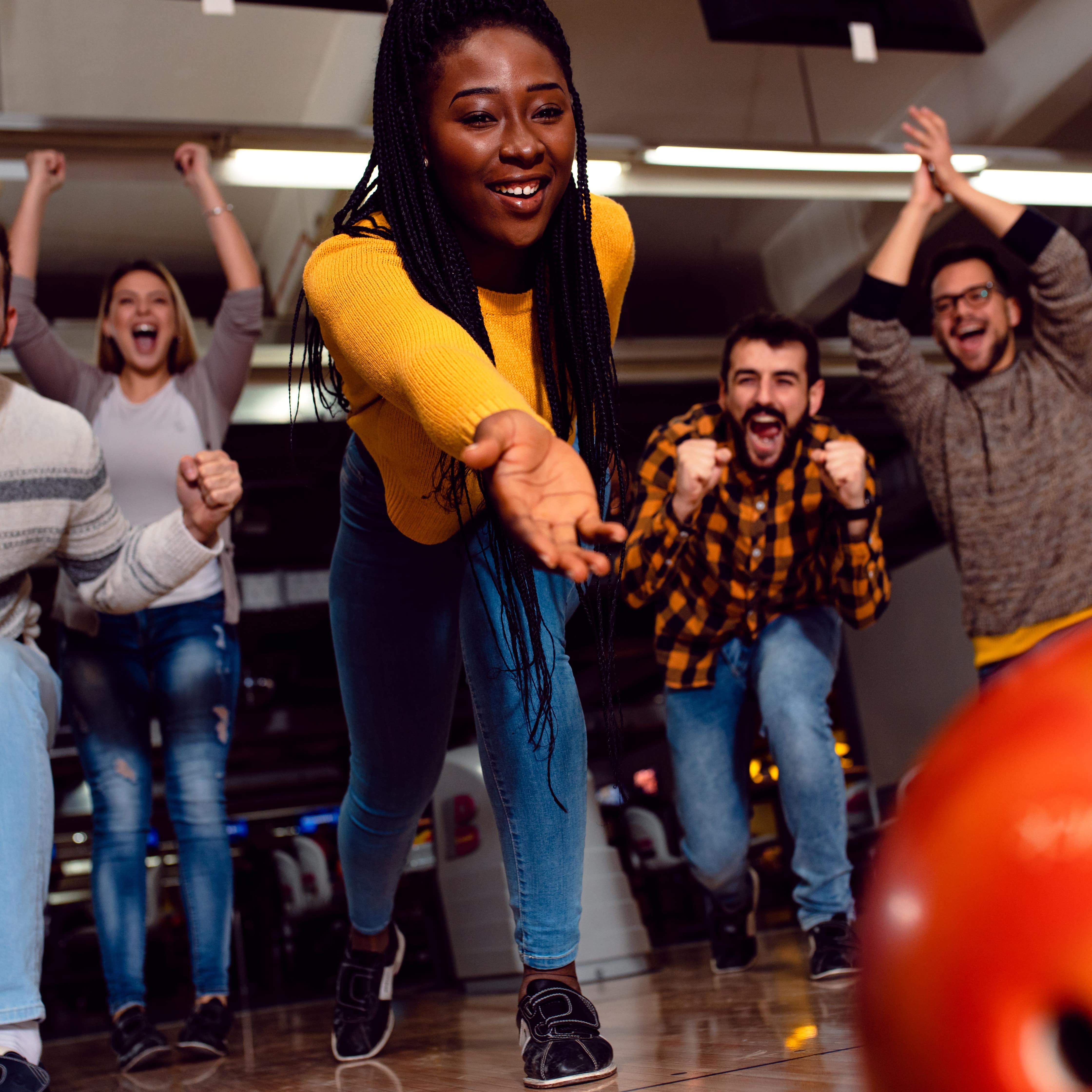 Group of friends bowling