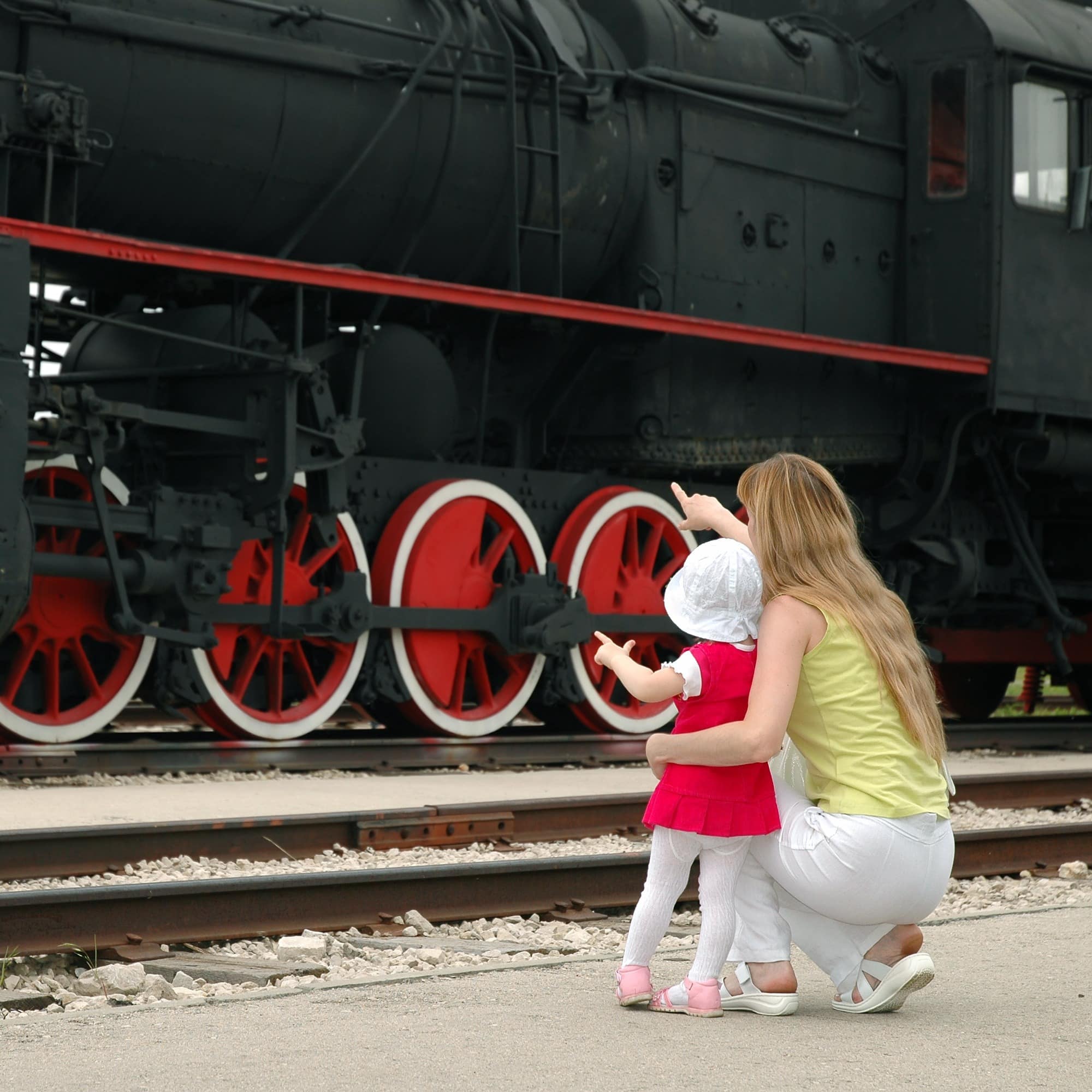 Woman and child looking at locomotive