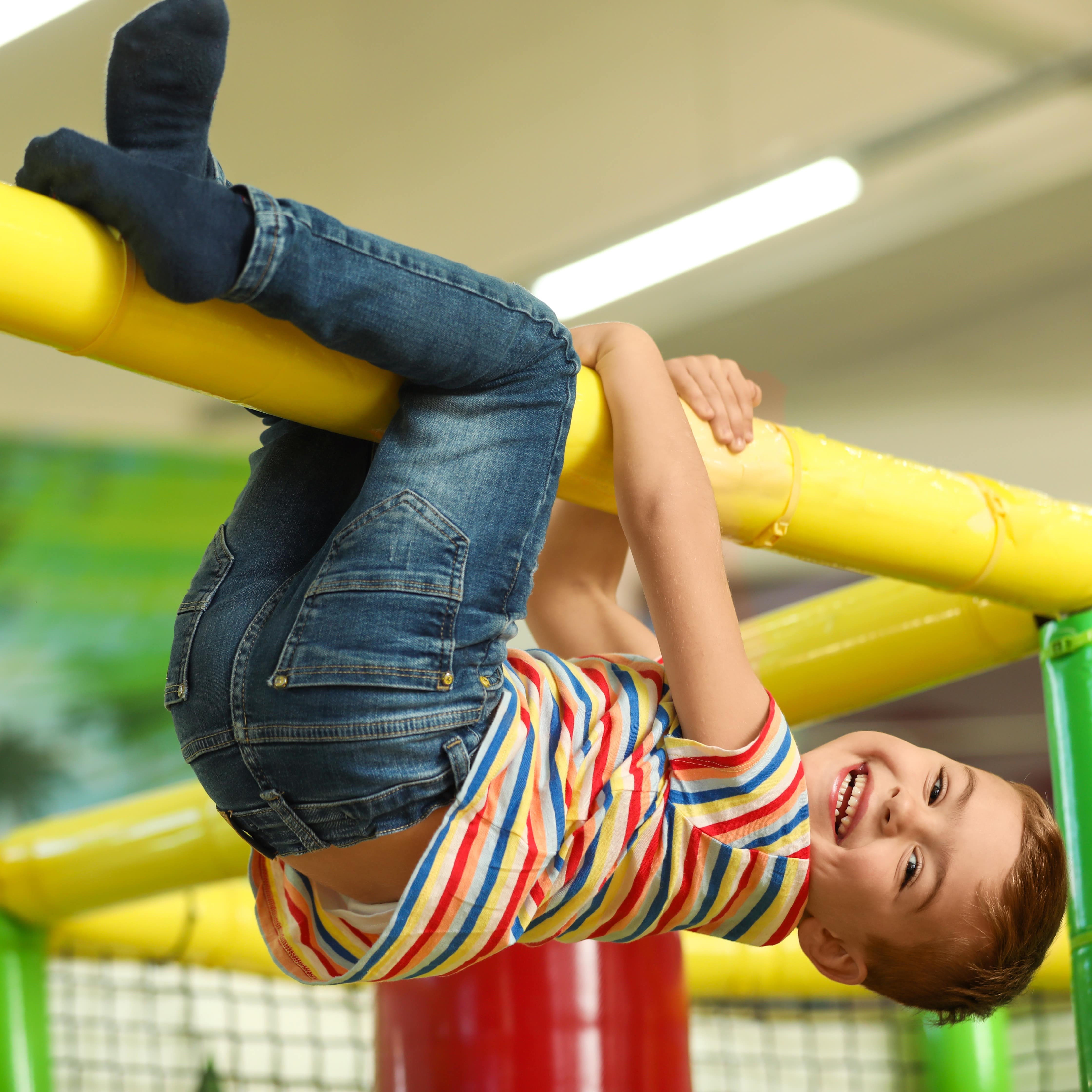 Little boy playing on indoor playground