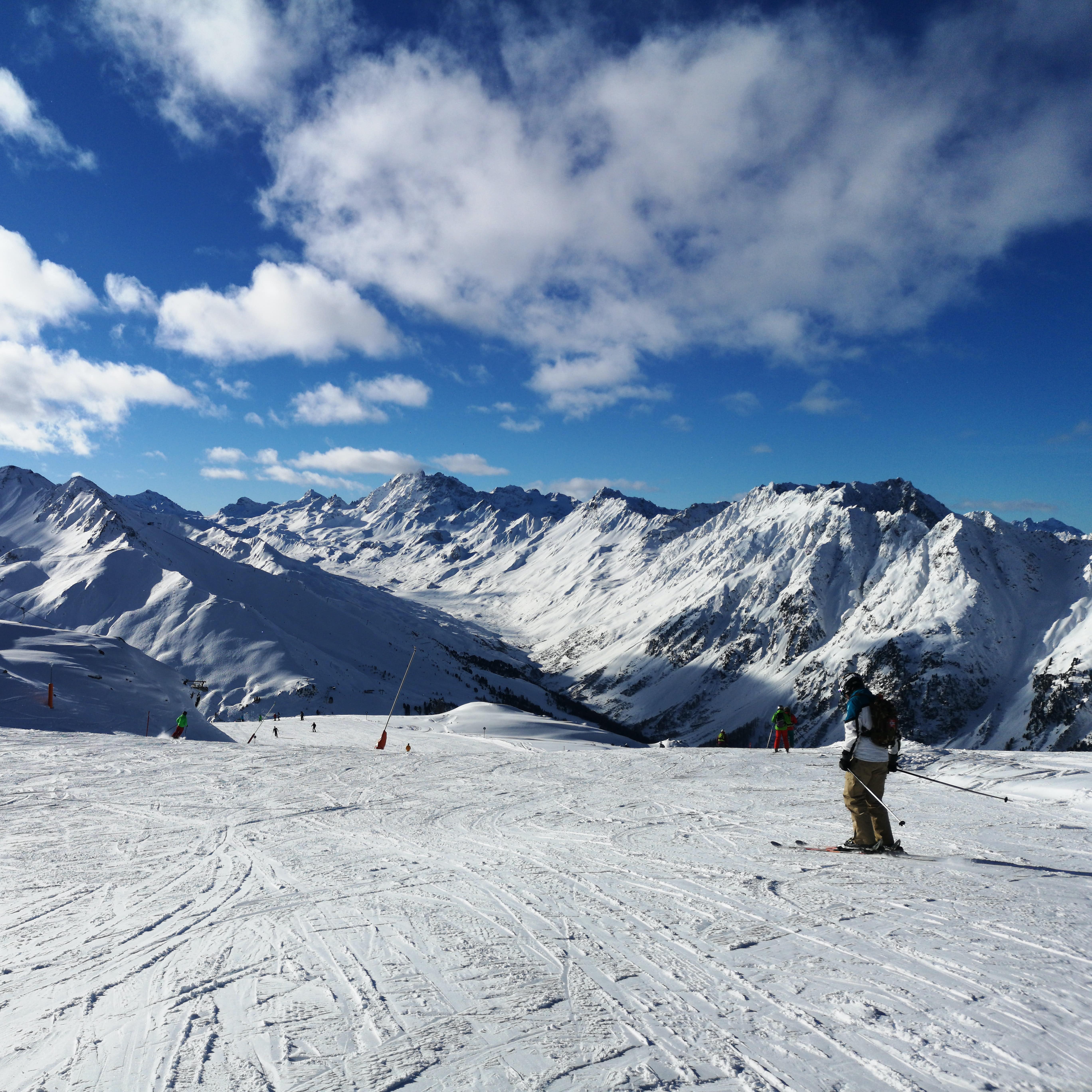 Skier on the top of snow-covered slope