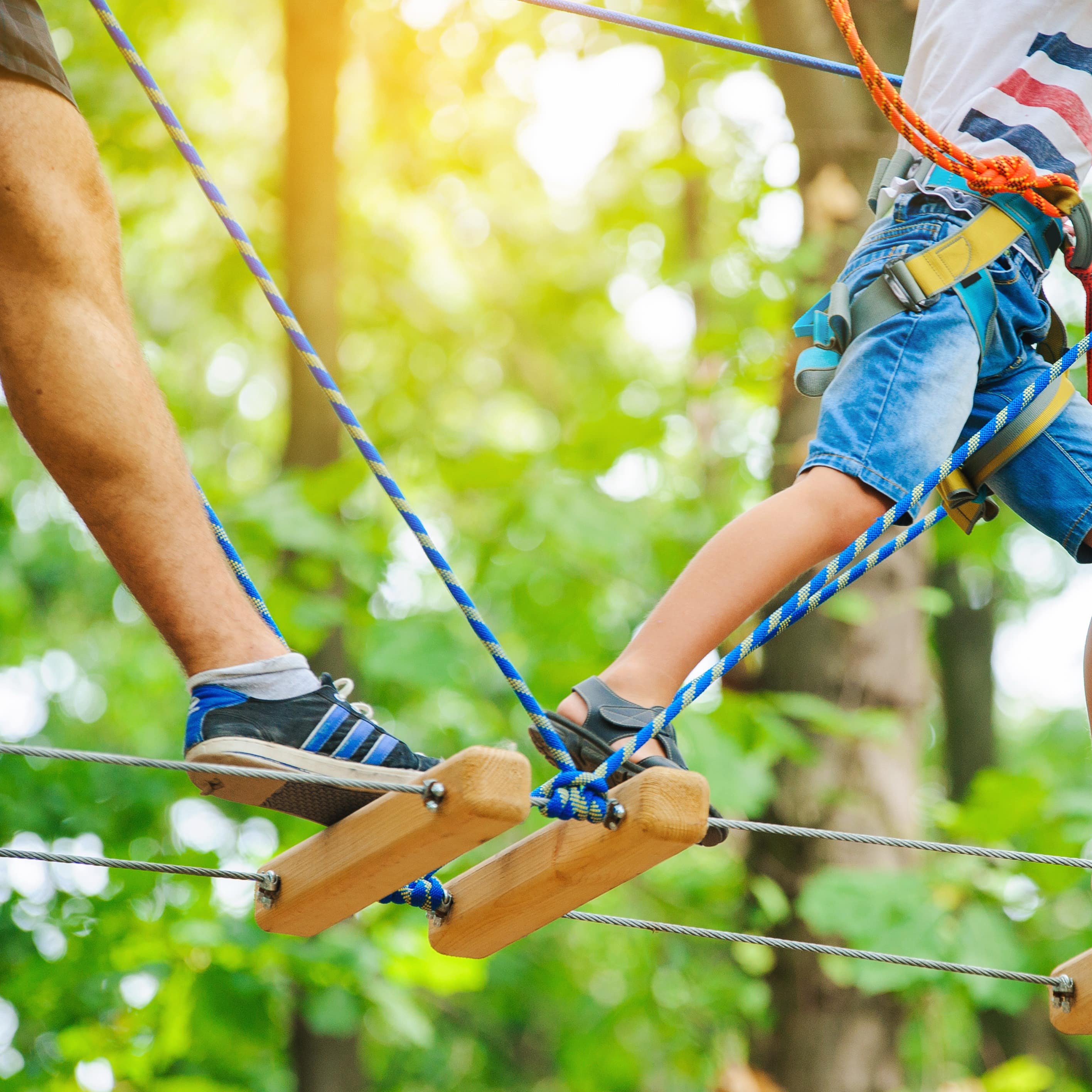 Adult and child on ropes course