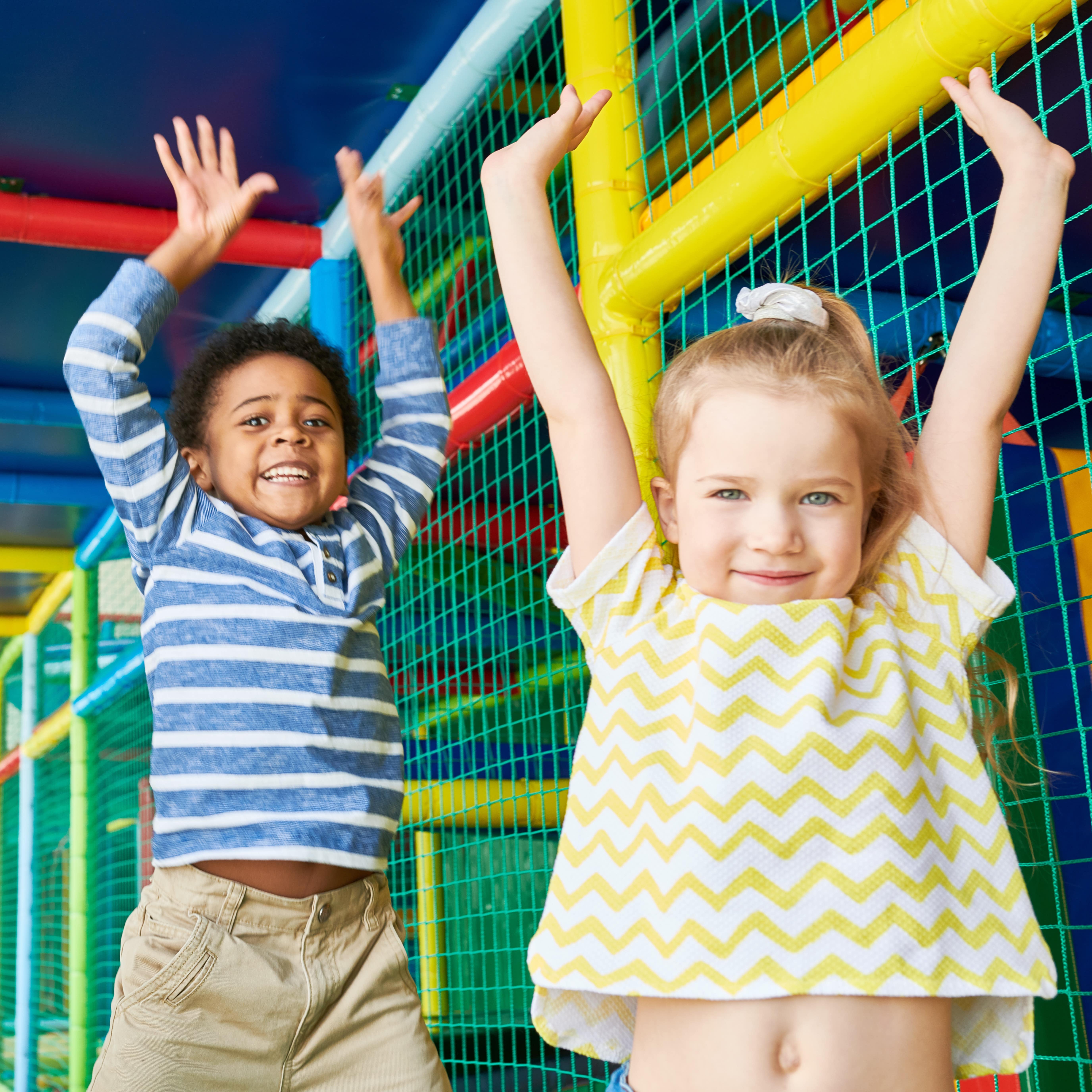 Two children playing at indoor playground