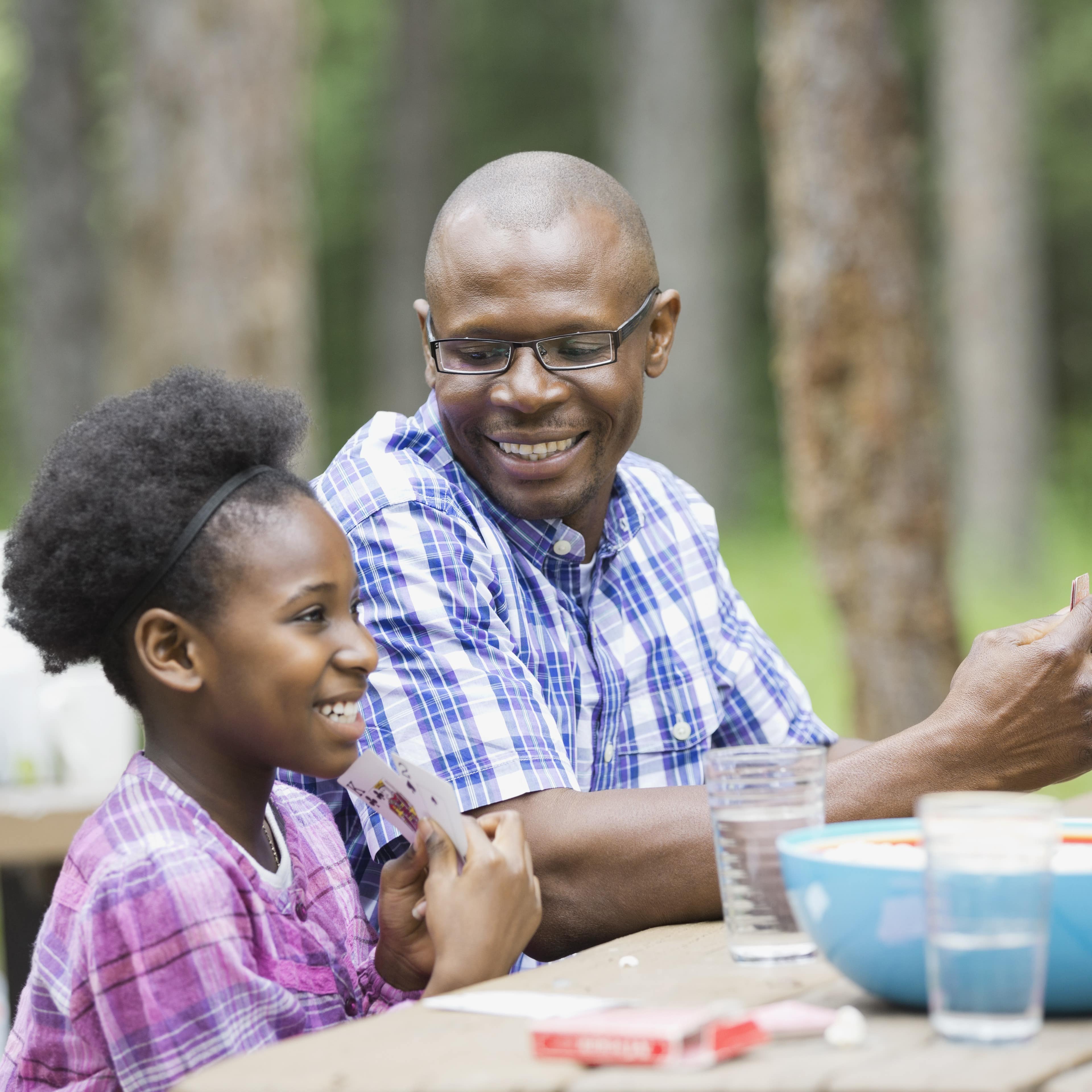 Dad and daughter at picnic table