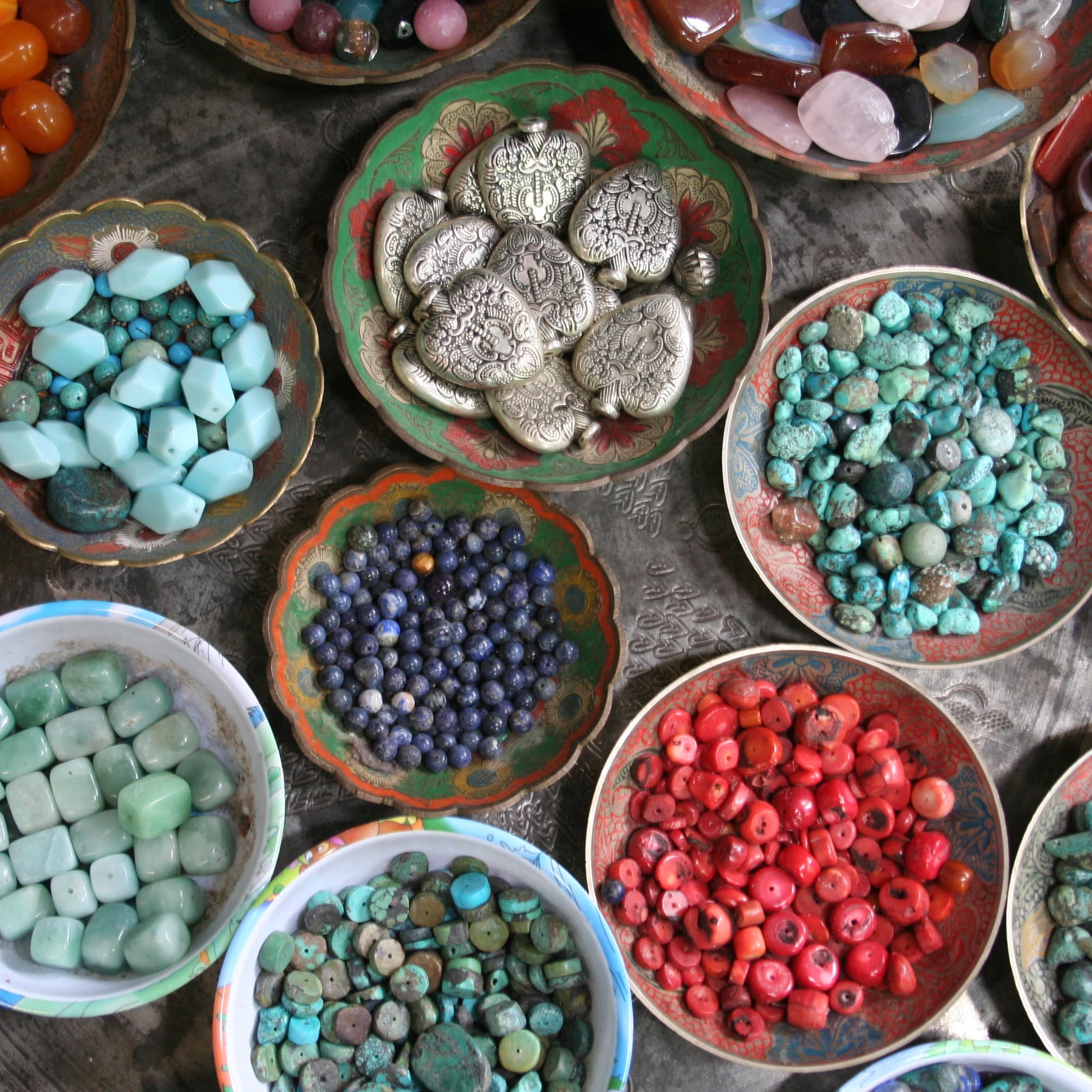 Beautiful coloured gems in bowls