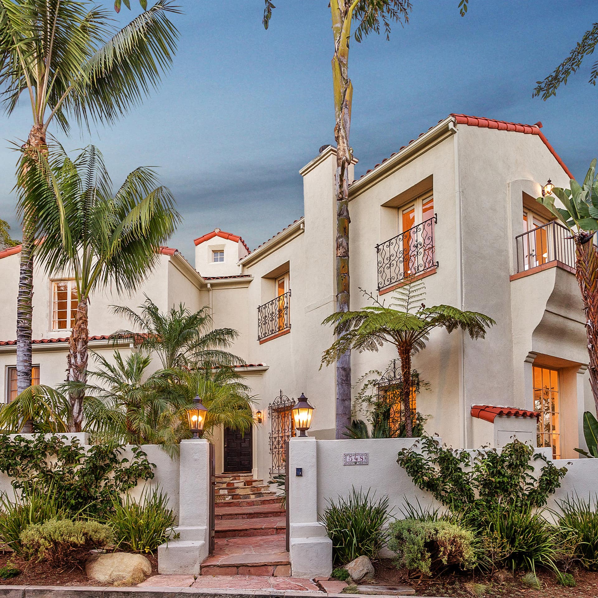 Spanish style mansion with palm trees in Brentwood, Los Angeles